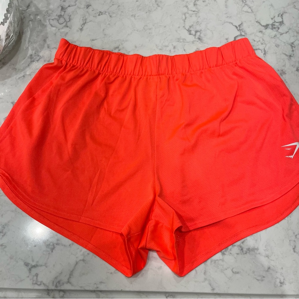 Gymshark neon orange/pink running shorts